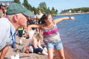 Paulina Backstrom of Grand Marais finished 2nd in the Rock Skipping Contest. She had 7 skips, just behind McKenzie Abbott who had 9. Right: The youth rock skippers accept their awards.