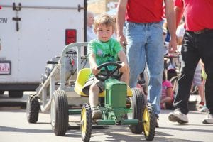 A determined Devan Rude of Grand Marais won 1st place in the 7-year-old group of pullers.