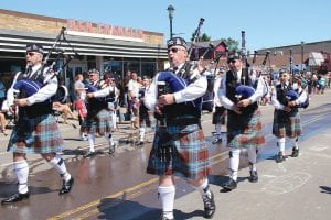 Above: The Thunder Bay Police Pipe Band earned the well-deserved Best Marching Unit. Right: The Fly Box didn’t win an award, but Scott Sorensen was a crowd-pleaser with his fly-casting float.