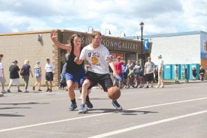 Fourteen co-ed teams participated in Hoopin’ in the Harbor. Abby Crawford with the Superior Savages guards Colton Furlong. Her team took 1st place in the friendly completion.