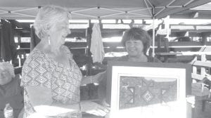 The winner of the painting by Steven Standing Cloud was also at the Rendezvous Days Powwow. Patty Rogers, a Grand Portage enrollee from Alaska generously gifted it back to the Elders to be raffled off at another time.