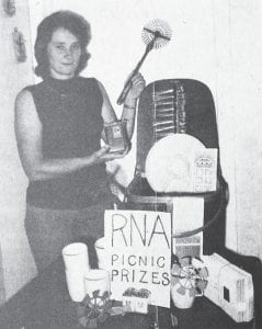 Prizes and a drawing were part of the activities for the first Royal Neighbors of America community picnic held in September 1975. In this photo, Roberta Bockovich, general chairman of the picnic, shows some of the items that were to be given away. The picnic was held at the Grand Marais Tourist Park and included a luncheon, children’s races and a drawing for the Burlington picnic basket (adults), and an Elgin transistor radio (juveniles). Mrs. Albert Malner won the basket and Todd Miller was the lucky recipient of the radio.