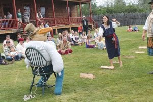 The goal of the Throw the Dough contest is to knock the hat off of the scarecrow, reenacting an event that occurred in the Great Hall in the 18th century. Competition was fierce, but competitors like Gabbie had a great time trying.