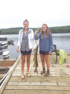 Kylie and Brynna Guimont from Cambridge, Minnesota got a surprise on August 12 while reeling in a small bluegill. This 35-inch northern pike decided it was hungry and they ended up landing it! They were fishing off the dock at their cabin at the lodge.