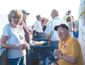 Tofte Historical Society Vice President Ginny Storlie visits with Mickey Lorntson on the August 16 North Shore Commercial Fishing Museum cruise aboard the Wenonah. During the cruise, Lorntson and Walter Sve shared stories of their families and the history of commercial fishing on Lake Superior.