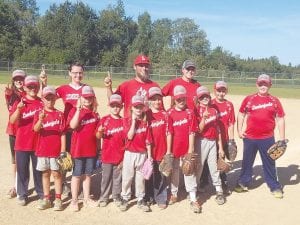 Above: The 2016 Parent Pitch Champs, the Lumberjacks. (L-R, front) Amber Theiner, Rohan Rude, Sidney Littest, Patience Sifferath, Devan Rude, Jorjah Backstrom, Amos Falter, Parker Backstrom, Jordan Backstrom, Tucker Nordman, Cade Smith. (L-R, back) Coaches Elissa Smith, Shem Falter, Paulina Backstrom. Right: The Twins were the 2016 Little League champs. (Front, lying down) Kole Anderson, Isaiah Deschampe. (L-R, seated/kneeling) Andrew Hallberg, Ryan Smith, Daunte Deschampe, Derek Smith, Maggie Smith, Brody Lacina, Recko Skildum. (L-R, standing) Patrick Pierre, Grace Nonnemacher, Sol Nies, Jon Pierre. (L-R, back) Kyle Anderson, Pat Pierre, Jerod Smith. (Not pictured Chris Skildum).