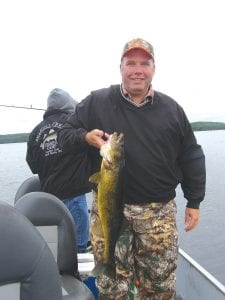 Left: Brian Retterath of Meyer, Iowa caught this 29 ½-inch hog on Northern Light Lake on a fishing trip guided by Mike Berg of Sea Gull Creek Fishing Camp.