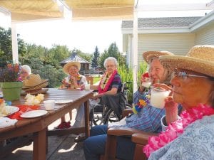 Care Center residents have had a fun summer. It was a beautiful afternoon on the patio for “Hilja’s Hawaiian Happy Hour”—complete with piña coladas and Hawaiian snacks! (L-R) Sharon Eliasen, Phyllis Noyes, Jane Burley and Gloria Martineau.