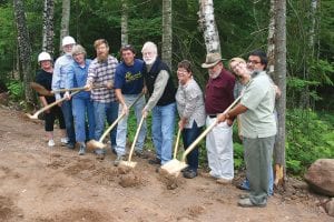 Area business people and local politicians brought out the “golden shovels” to participate in two groundbreaking ceremonies for new or expanding businesses held at Cedar Grove Business Park Saturday, August 27. (L-R) Pat Campanaro, Jack McHugh, County Commissioner Ginny Storlie, Grand Marais Mayor Jay Arrowsmith DeCoux, Max Wahlers, Grand Marais City Councilor Tim Kennedy, Cook County/Economic Development Authority Director Mary Somnis, Cook County Chamber Director Jim Boyd, Lee and Dr. Nader Samari.