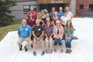 Left: There is quite a contingent of new teachers at Cook County Schools/ISD 166 this year. They took a break from orientation on Monday, August 29 for a photo. (L-R, front) Jim Lundorrff, 5th grade; John Paul, Special Education, kindergarten – 5th grade; Rachel Liechty, Early Childhood Special Education; Maggie Friedrichs, Spanish; Pamela Foster, preschool and Early Childhood Family Education. (L-R, middle) Autumn Clearwater-Day, preschool; Priscilla Beck, art; Emma Spoon, 7th grade science, health and physical education and kindergarten – 3rd grade physical education; Brianna Valbrecholt, music; Megan Rubbelke, high school math. (L-R, back) Peter Lucken, middle school social studies; Amanda Hand, 2nd and 3rd grade; Dave Hanson, industrial technology; Evan Morris, high school special education; Chad Benesh, high school science. Above: As well as a number of new teachers, there are several new—or new to full-time—paraprofessionals. (L-R) Tom Sullivan, Lori Austin, Stephanie Lundorff, Jenna Berglund, Diane Stoddard, Rochelle Staley, Elissa Smith.