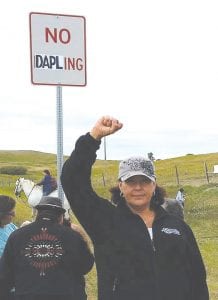 Dana Logan of Grand Portage shows her support for the people at the encampment at the route of the Dakota Access Pipeline (DAPL).