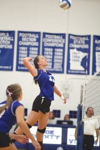 Above: Alyssa Lashinski went airborne as she set up to make one of her seven kills in the Vikings’ win over Barnum. Right: Hannah Toftey (9) set the ball to Tarin Hansen (6) while Emily Jacobsen (1) got ready to assist if need be in the Vikings’ game against Barnum.