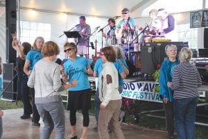 Volunteers with the Violence Prevention Center, in their “Be the Good in the World” T-shirts, danced to the upbeat Scotty’s Coast Connection Band, featuring Scotty Player, John “Dack” MacDonald, Bruce “Deano” Dean, Don Bauer, Al Hedstrom and Joe Higgins.