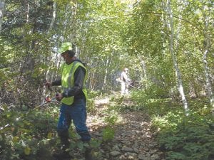 Trail clearing volunteers frequently not only volunteer their time, but also their own equipment. Thanks to a grant from Tread Lightly ®, Cook County ATV Club members Chuck Bolinger (front) and John McClure had an additional brush cutter to clear the Portage Brook Trail in the Hovland area.