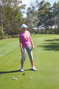 Above: Pondering her putt, Paula Sundet Wolf narrowly missed on three attempts in the Rally for a Cure putting contest. Those who made a putt were entered into a drawing for prizes. Right: Royalty was on the course on Sunday in the form of “Golf Queens” Linda Walker and Sue Hansen.