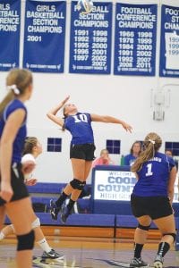 Reilly Wahlers went up high to make this kill in a recent home game. Wahler's play at the net is improving rapidly, and it gives the Vikings another option to run their offensive plays through, said Head Coach Pam Taylor.