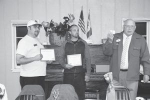 The Grand Marais Lions Club welcomed a new member—and the Lions Club District Governor to their September 17 meeting. (L-R) New member sponsor Lion Rob Hackett, newly inducted Lion Adam Brandt, District Governor Mel Milender.