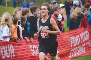 Pushing hard for the finish line at the Swain cross country meet held in Duluth at Enger Park golf course was North Shore Storm runner Jake Paron. Paron finished in second place. He was the only Storm runner entered in varsity races at the highly competitive Swain cross country meet.