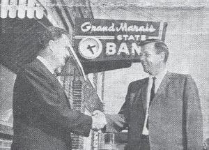 State Senator Ray Higgins of Duluth was among the dignitaries present in September 1966 for the Grand Marais State Bank’s 50th anniversary. Higgins, left, is shown congratulating the bank’s president Richard I. Anderson.