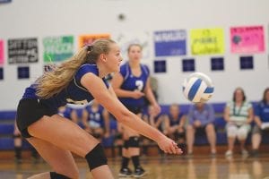 Above: She’s no “bump on a log.” Instead the highly active Meredith Sutton is not only the team’s best front row player, she is also one of the best back row players. Here she gets set to bump the ball, setting up a play. Far right: Ready, set, go! Showing perfect form, Reilly Wahlers made a perfect set-assist to her front line who spiked home a winner on this perfect pass. Right: Emily Jacobsen went up high to put a little “Viking magic” on this ball.