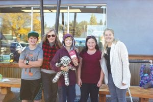 Above: The Moose Medallion Hunt was a wild affair, with many medallion hunters running down the clues and searching throughout town for the elusive medallion. This year’s winner was Miles Elfvin. Here with Miles is from L-R: Recko Skildum, Anna Klobuchar, Miles Elfvin, Anna Ahonen and Katie Krantz.