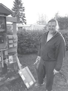 After years of work, Mike Chmelik dismantles his construction project electrical system. Mike and his wife Teresa own and operate Croftville Road Cottages in Croftville and will soon open a beautiful new lodge on the site overlooking Lake Superior.