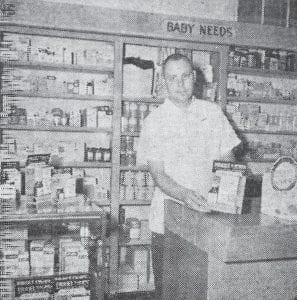 This photo of druggist John McElevey appeared in the Cook County News-Herald on April 18, 1963 as the Peterson Drug Store moved to its new location in the Arrowhead Hotel. Renovation of the hotel space had been taking place over the winter, with Clark McElevey in charge of the work. Druggist John McElevey told the News-Herald that the new space would give the drug store about 70 percent more space. Besides McElevey, the regular employees are Mrs. Jeff Halverson and Mrs. Bernard Skoog. Part time workers are Beverly Olsen and the former storeowner A.L.E. Peterson.