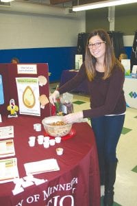 Above: Kaisha Graham, a SNAP coordinator from the University of Minnesota, Duluth, was on hand to give out healthy recipes and answer questions about healthy eating. Left: Denise Axtell gave Georgene Daubanton a flu shot. Blood pressure readings were also offered to the public.