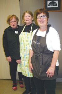 Right: Ada Igoe and her mother Mary Igoe were just two of many volunteers at the Empty Bowls fundraiser held last Thursday at Bethlehem Lutheran Church in Grand Marais. Almost 400 people attended the event. Above: Three of the main organizers for Empty Bowls who were working long after the crowd had left were, from front to back: Beth Kennedy, Lee Stewart, and Pat Campanaro. Not pictured is Kelsey Kennedy who also did a lot of the work to make this event so successful.