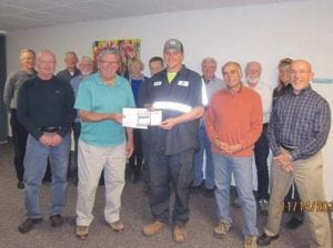 Barry Pedersen stopped by the North Shore Health Care Foundation board meeting on Monday, November 14 to pick up his prizewinning check from Executive Director Karl Hansen. Barry won $10,000 when he made a hole-in-one at the North Shore Health golf tournament, which is a fundraiser for the foundation. The $10,000 check is from Hole-in-One Insurance, and Barry proudly holds his golf scorecard. He reported that this past weekend he and his brothers enjoyed the bottle of Dom Perignon that his grandfather, the late Richard Anderson, purchased in 1979 to celebrate the first hole in one in the family. Board members from L to R are Mark Ditmanson, Jim Shinners, John Bottger, Jack McHugh, (Karl), Paula Sundet Wolf, Jerry Lilja, (Barry), Paul Nelson, Bob Fenwick, Steve Nielsen, Inger Andress, and Loren Stoner.