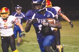 Above: Sam O’Phelan led the Vikings' ground attack this year. The durable all-purpose running back was named First Team All-Conference for his play on the gridiron by area coaches. Right: Dillon Sjogren and Ethan Sporn (on his knees) gang tackle the opposing team’s ball carrier (23). Both were named Honorable Mention All- Conference. Far right: The elusive Andrew Miller also was named Honorable Mention All-Conference.