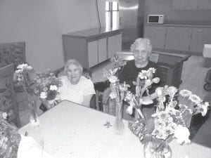 Above: Bernice Legarde and Lorraine Wipson are pictured here arranging flowers for the Thanksgiving Day tables. Thanks to Terra Bella and the Whole Foods Co-op for their donation of flowers! Left: Bob Heideman was the lucky winner of a turkey at our annual Turkey Bingo held on November 17th.