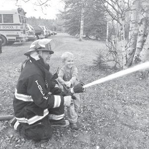 The Tofte Fire and Rescue squad visited Birch Grove Community School in October for Fire Safety Week. K-5 and the (pre-school) Saplings were, once again, very impressed with the fire and rescue volunteers and all the equipment that they brought to the school. Of course, getting to use the fire hose was the highlight, but children also had an opportunity to check out some of the rescue equipment, had a chance to ask questions, and each student received a goodie bag that included a cool glow in the dark Tofte firefighter hat. Many thanks to Tofte’s volunteers for continuing to visit each year and share with the students at Birch Grove Community School.