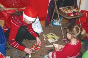 Right: Girls Scouts worked hard on Saturday, December 3 to host a very busy and well-attended Santa’s Workshop in the basement of the First Congregational Church in Grand Marais. The Girl Scouts made ornaments, helped cook breakfast, offered free daycare so parents could shop, and when the event was over, helped clean up. Proceeds of this festive event help to fund local Girl Scout activities.