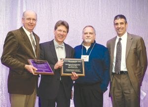 Cook County Commissioner Garry Gamble (pictured on the left) accepted the County Conservation Award for Cook County at the Association of Minnesota Counties annual conference held December 5 in Minneapolis. Cook and Lake counties were honored for their partnership and collaboration with each other on the development of the Lake Superior North Watershed Management Plan.