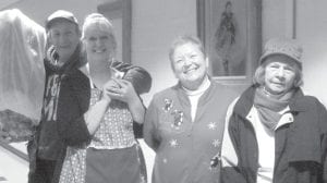 John Wheeler, Missy Ullman, Gale Carlson and Dianne Johnson are all smiles as they head home after having a great time at the Elders' Christmas party.