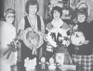 “Christmas Old and New” was the theme of the 1978 Holiday Homes Christmas Bazaar, an annual event sponsored by the North Shore Hospital Auxiliary. Shown displaying a few of the many craft items which were displayed for sale are, from left, Carol Seglem, Irene Malner, Bev Johnson and Darlene Miller. The event also featured a coffee and goodie house at the North Shore Nursing Home’s lounge.