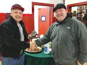 Ben Petz, left was given a gift for his 35 years with the Hovland Fire Dept. Fire Chief Charlie LaBoda presented Ben with a clock. To see more pictures of the celebration for Ben, visit: hovlandvfd.com