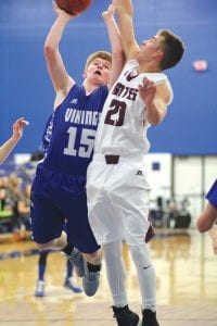 Leif Anderson (15) put up a one-hand shot against the Wren defender (21).