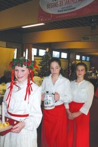 Each year Bethlehem Lutheran Church hosts Julefest, and the Scandinavian event features a visit from Lucia, who wears a crown of candles and brings a tray of saffron buns to share. The event is held near the shortest day of the year and honors St. Lucia and celebrates the return of the light. Isabella Sparks was this year’s St. Lucia at Julefest held on Saturday, Dec. 10. With her are attendants Cecelia Chmelik (holding the coffee pot) and Amy Carpenter.