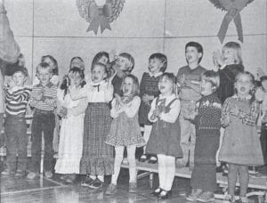 Kindergarteners at Sawtooth Elementary School in Grand Marais put on a joyous Christmas concert in December 1981. Choral director Paul Muus led the group. Some of the younger students were also invited to perform with the senior high school choir for a few combined numbers during the Dec. 10 event.