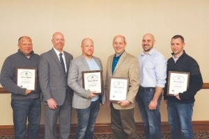 Staff from the Cook County Highway Department (CCHD) and Northland Constructors of Duluth, LLC, (Northland) was on hand to receive the County/Municipal Rural State Aid Paving Award for the Sawbill Trail paving project on December 7. Pictured (L-R) are Jason Rothmeier, Northland; Ted Schoenecker, Minnesota Department of Transportation, State Aid; Chris Magnuson, Northland; David Betts, CCHD; Andy Edlund, Northland; and Aaron Holmgren, Northland.