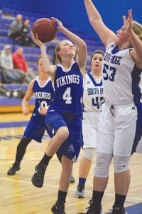 Far left: Sarah Toftey made a nice move to get open for this shot which she made against the South Ridge Panthers. Left: Emily Jacobsen always works in the paint to get free for a basket. No one takes more punishment in a game than Jacobsen, but she never complains. Above: Bayley Cox had her best game of the season against the Panthers, filling up the stat box with her scoring, rebounding, and playing great on defense.