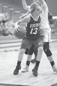 Along with her twin sister Sarah, Hannah Toftey (13) performs much of the guard play for the Vikings this winter.