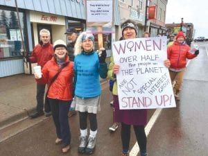 Taking part in the Women’s March in Grand Marais was, from L-R: Gina Todd, Debbi LaMusga, and Jennifer Shoals. It was estimated that 120 people took part in the march.