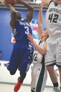 Always drawing a crowd, especially when he has the basketball, Sam O’Phelan fought off two Nighthawk defenders to score two points in a game that the Vikings won.