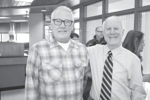 The Grand Marais State Bank held a retirement party open to the public on President Mike LaVigne’s last day at work, January 27. One of the people who came to wish him a farewell was Rick Anderson (L), grandson of A.M. Anderson who started the bank, and son of Richard (Dick) Anderson who ran the bank when A.M. retired. LaVigne, who spent 33 years in charge, is only the third president in the history of the Grand Marais State Bank, which opened in 1916.