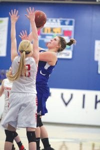 Left: Emily Jacobsen put up a shot against her Cromwell defender. Anytime Emily touched the ball, she drew a nice aggressive crowd of Cromwell defenders. Above: Arianna Poyirier shows off nice shooting form against Cromwell.