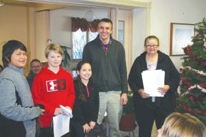 One of the 33 nonprofit groups to receive a check from the First & Second Thrift Store was the Sawtooth Elementary Student Council. Members of the student council from L-R: Ogima Currie, Ray Dressely, Taya Fairbanks, I.S.D. 166 Assistant Principal Bill DeWitt and Senior Center Director Bev Green.