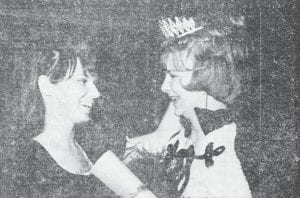 It was a festive time at Grand Marais High School in February 1967 as the basketball team prepared for the tournament at the Duluth Arena, and the hometown fans readied with queens and cheerleaders, pep and points, crowds and cheers, bands and baskets, and everything else that went into the great spectacle. Seen here are Debbie Krueger, right, who was named Homecoming queen, being congratulated by Ceil Critchley, who held the royal title the previous year.